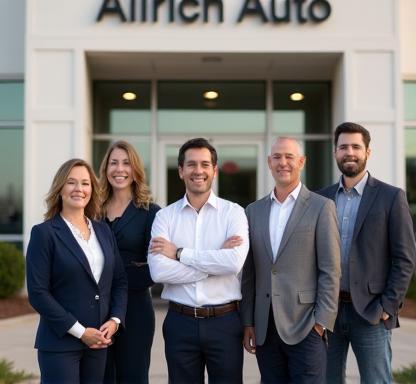Allrich Auto team members standing in front of dealership entrance